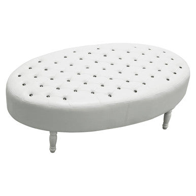 White ottoman with a perforated design on a white background
