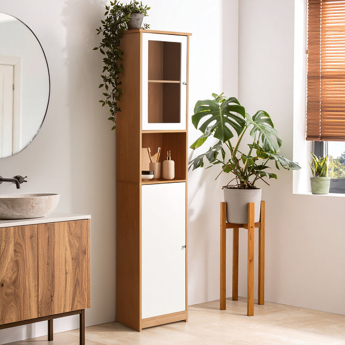 Bathroom interior with wooden cabinet, sink, and plants