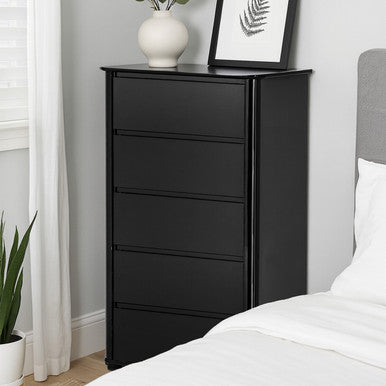 Black dresser with four drawers in a bedroom setting.
