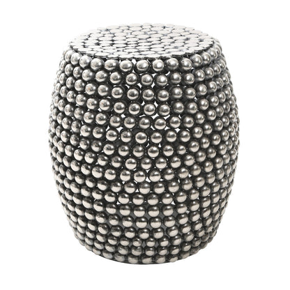 Decorative stool with metallic bead embellishments on a white background