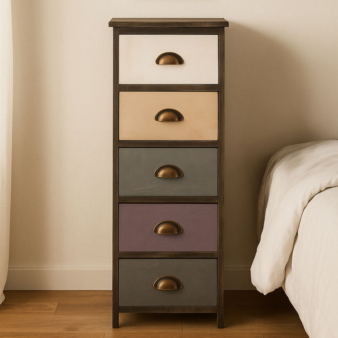Tall wooden drawer unit with five colored drawers next to a bed in a bedroom.