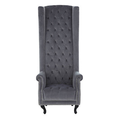 Gray tufted wingback chair on a white background