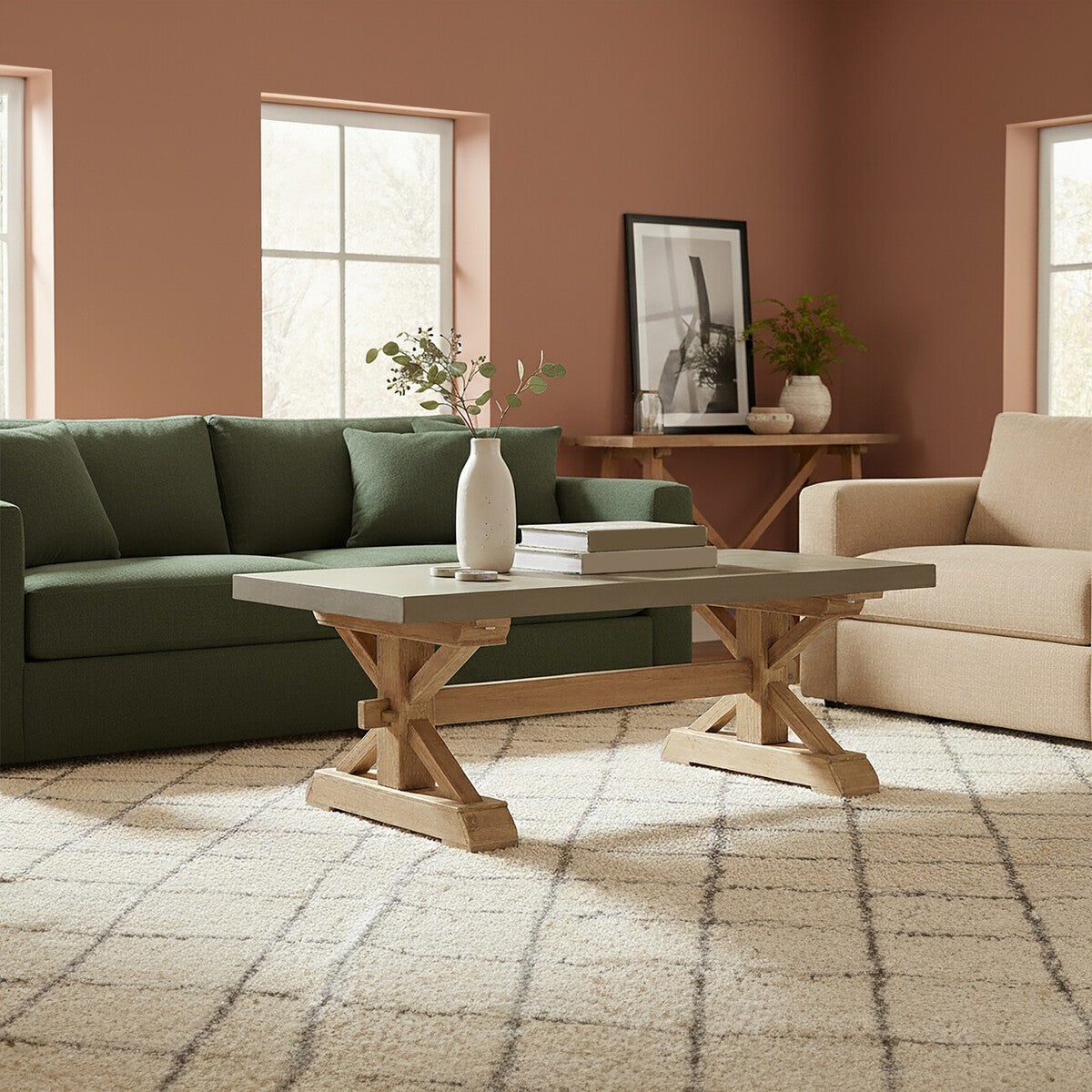Living room with green sofa, beige armchair, and wooden coffee table.