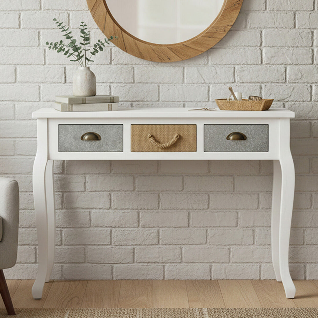 White console table with three drawers against a brick wall