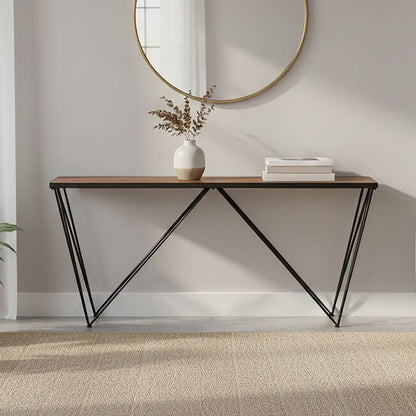 Modern interior with a round mirror, console table, and plants.