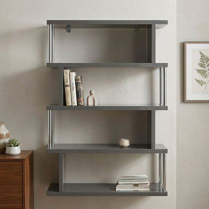 Gray wall-mounted bookshelf with books and decor items against a neutral wall.