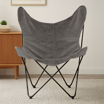 Gray butterfly chair with black metal frame in a room setting.