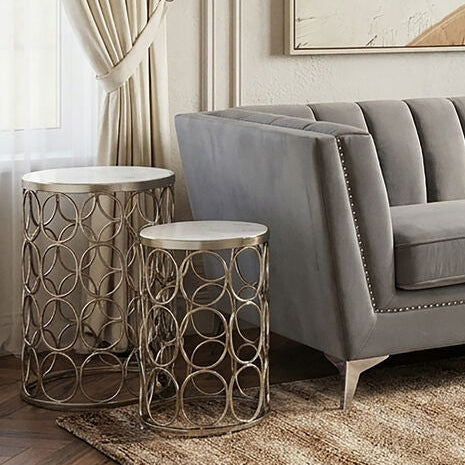 Modern living room with gray sofa, abstract art, and chandelier