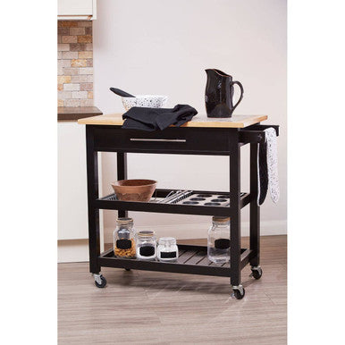 Kitchen cart with wooden top and black base in a kitchen setting