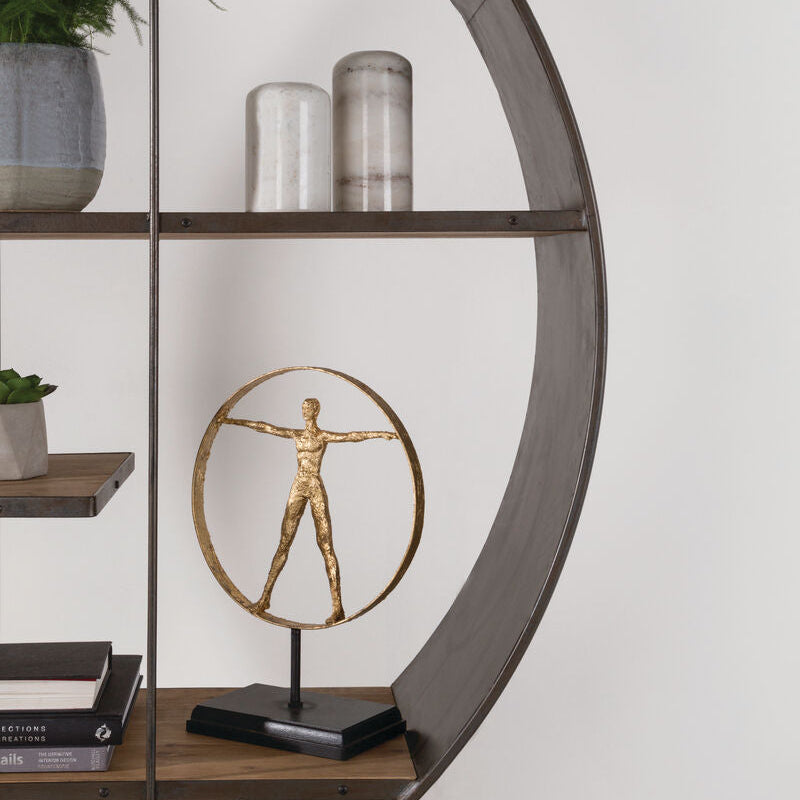 Decorative sculpture on a shelf with a circular wooden frame and white wall background