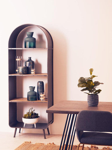 Modern office setup with a bookshelf, desk, and chair against a white wall.