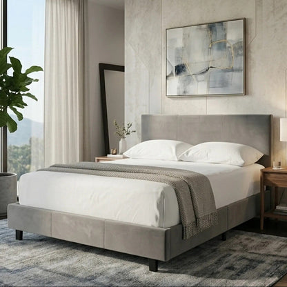 Modern bedroom with a gray upholstered bed, white bedding, and abstract art on the wall.