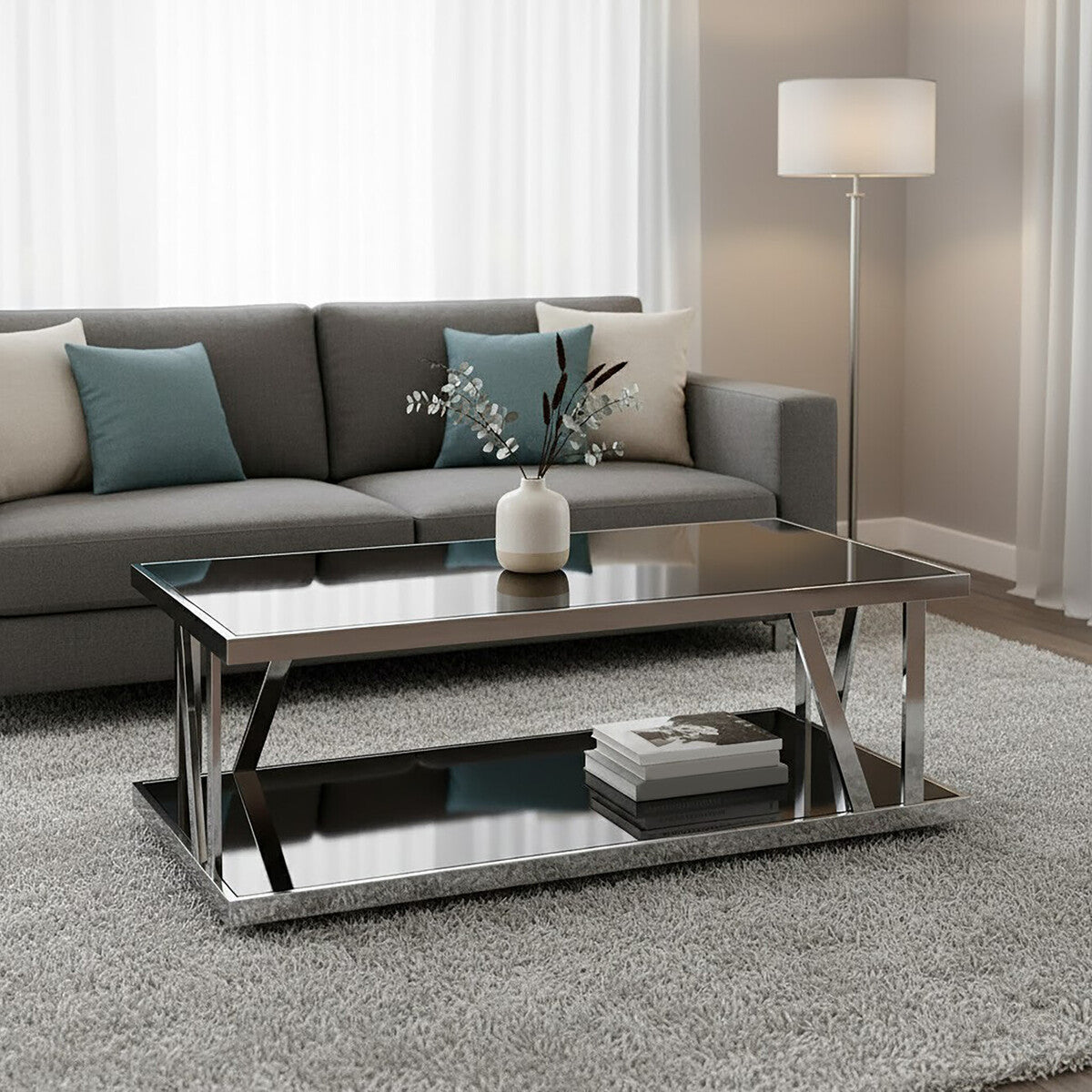 Modern living room with a gray sofa and glass coffee table.