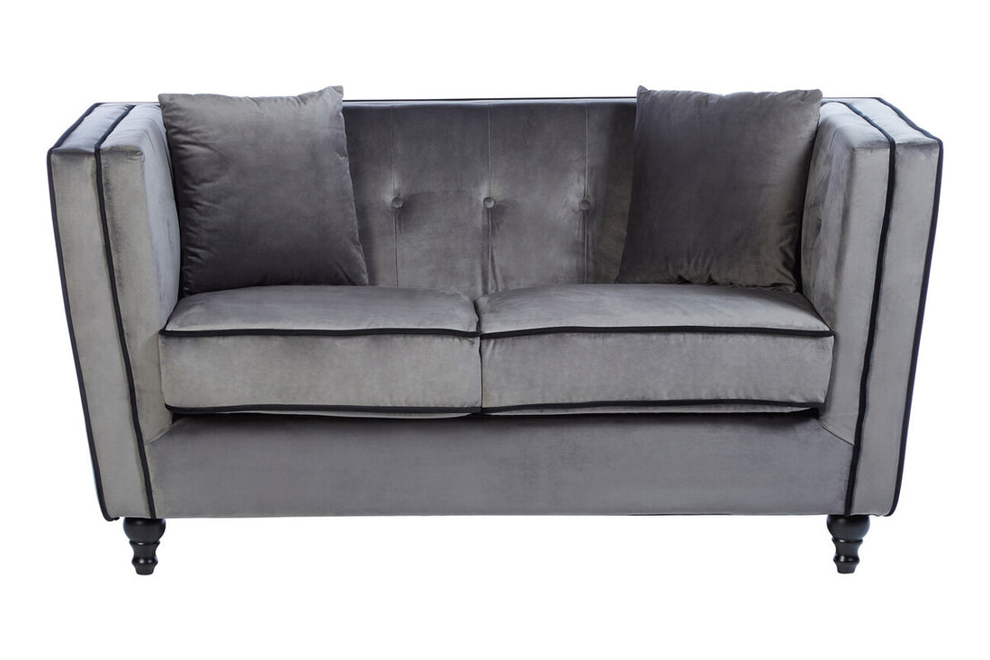 Gray sofa with tufted backrest on a white background