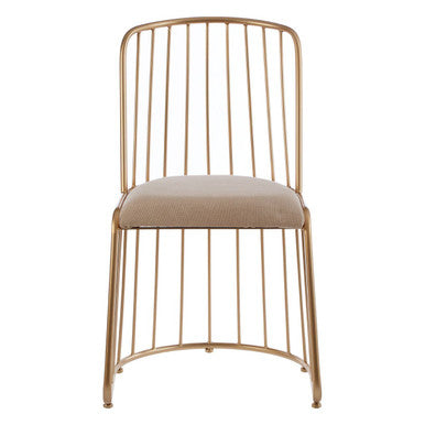 Gold metal chair with beige cushion on a white background