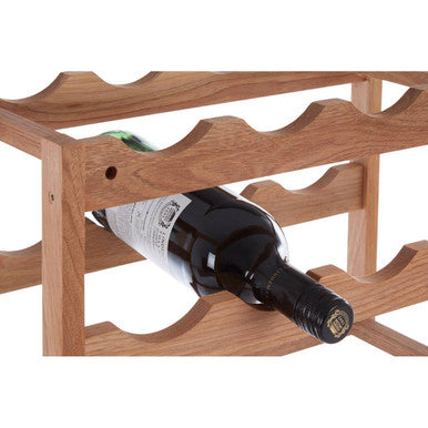 Wooden wine rack with a single bottle of red wine on a white background
