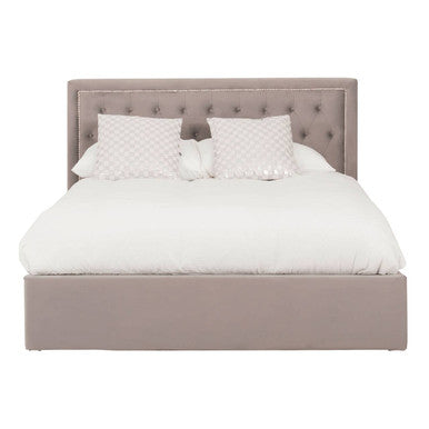 Gray upholstered bed with white bedding on a white background