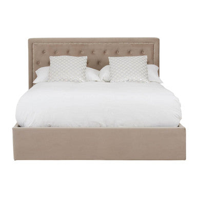 Beige upholstered bed with white bedding on a white background