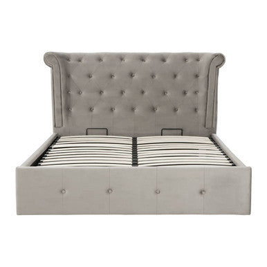 Gray upholstered bed with tufted headboard on a white background