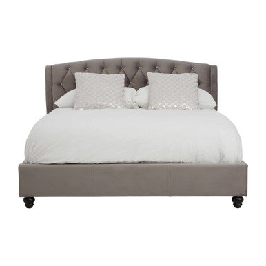 Gray upholstered bed with white bedding on a white background