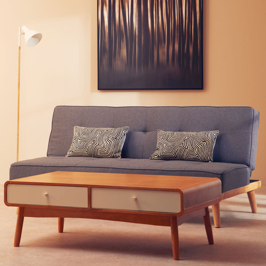 Gray sofa with wooden coffee table and abstract art on wall in living room
