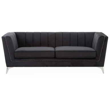 Black sofa with nailhead trim on a white background