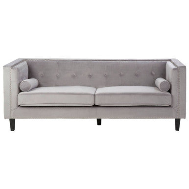 Gray sofa with tufted backrest on a white background
