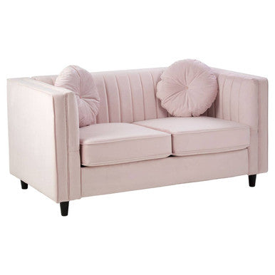 Pink sofa with decorative pillows on a white background