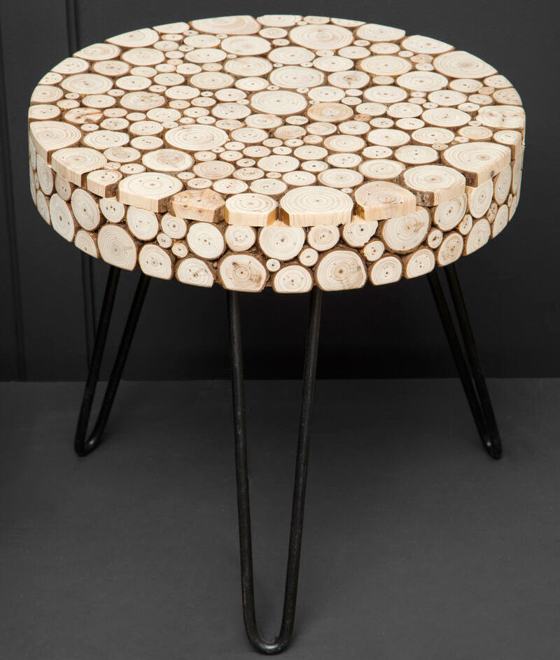 Round table with wooden slat top and black metal legs on a dark background