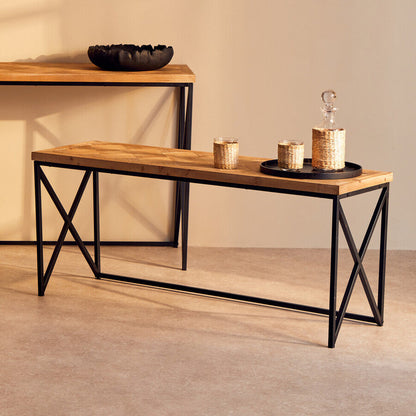 Two wooden tables with metal frames against a plain wall.