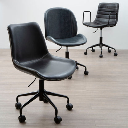 Three black office chairs on a wooden floor with a white wall background