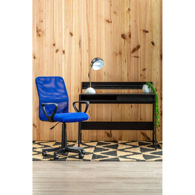 Blue office chair and black desk against a wooden wall.