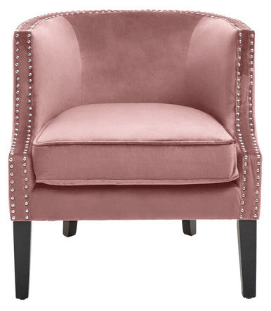 Pink velvet armchair with nailhead trim on a white background