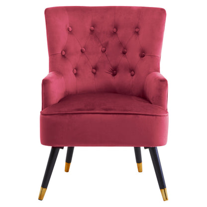 Pink armchair with buttoned backrest and black legs with gold tips on a white background