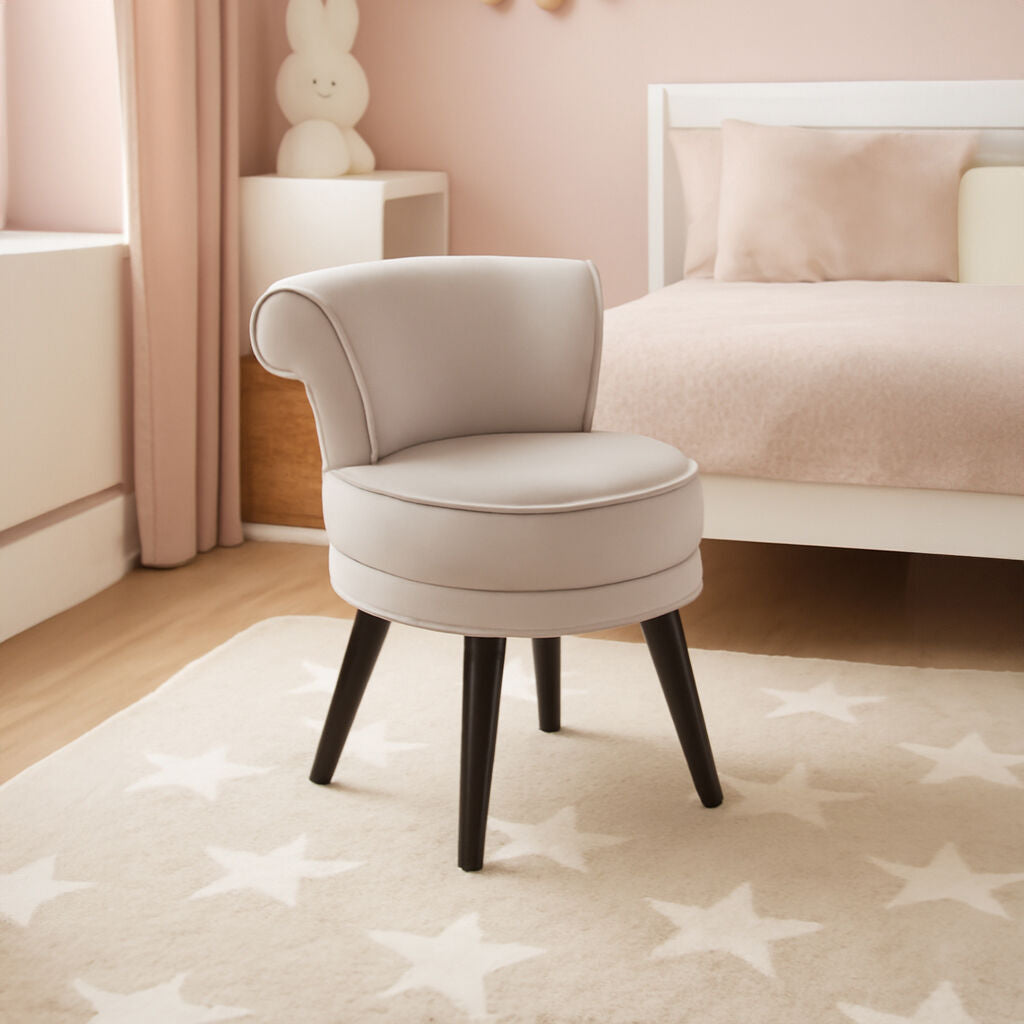 Small round chair with black legs in a bedroom setting