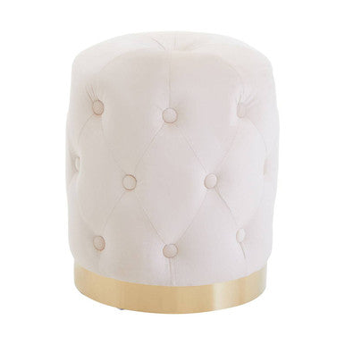 White tufted ottoman with gold base on a white background