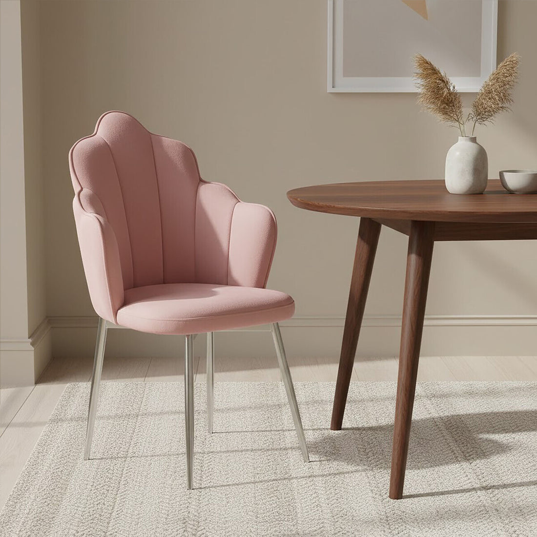 Pink chair in a room with a wooden table and decorative elements.