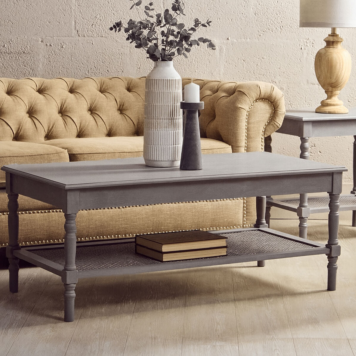 Gray coffee table with decorative items in a living room setting