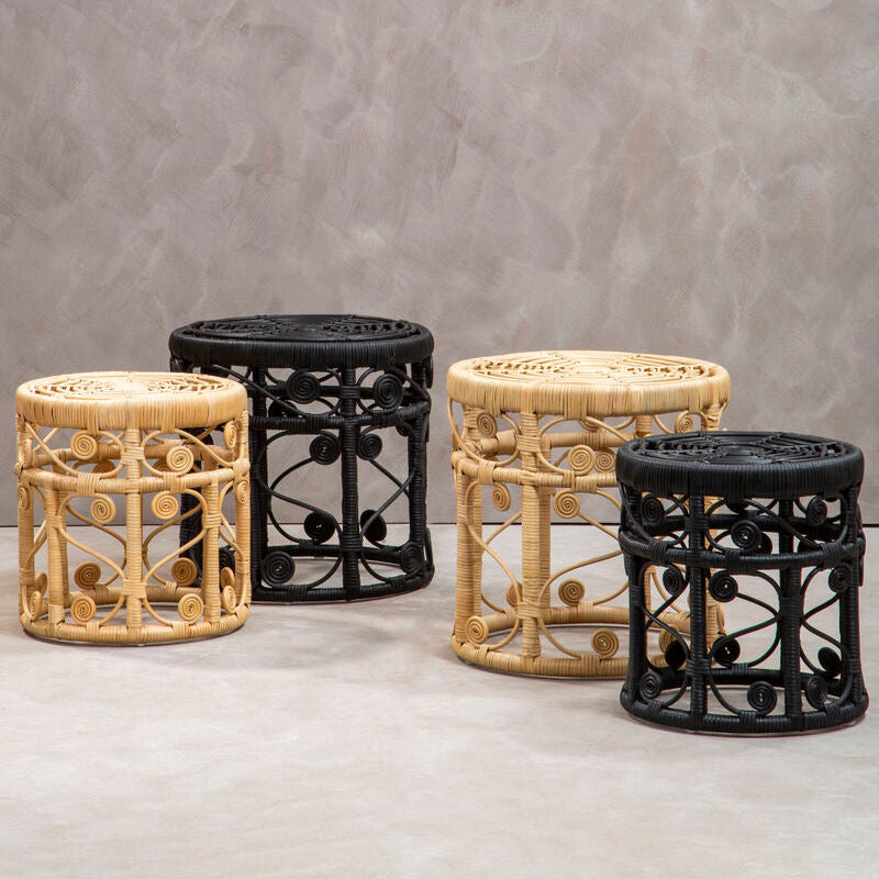 Four decorative stools with rattan and metal designs on a gray background