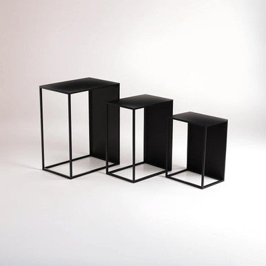 Three black rectangular display stands on a white background
