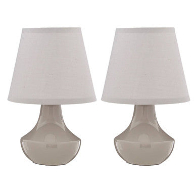 Two table lamps with white shades on a white background