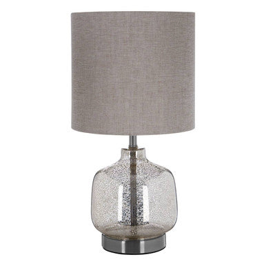 Table lamp with a gray fabric shade and clear glass base on a white background