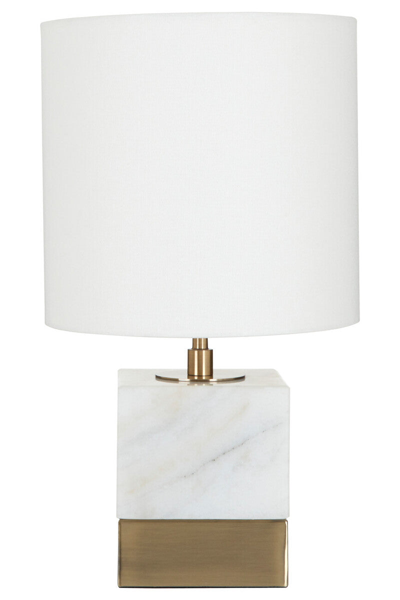 Table lamp with white shade and marble-like base on a white background