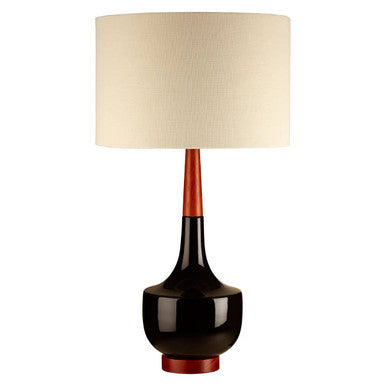 Table lamp with a black base, red accent, and beige shade on a white background