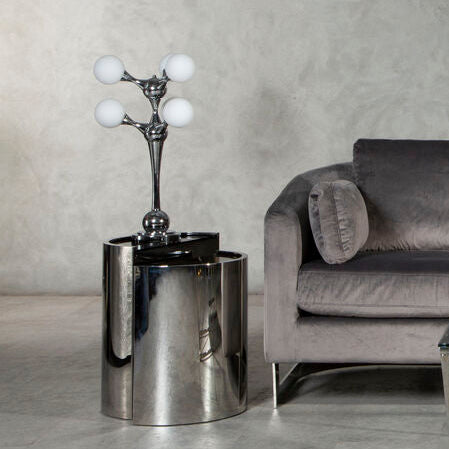 Gray sofa with a coffee table and ottoman in a modern room.