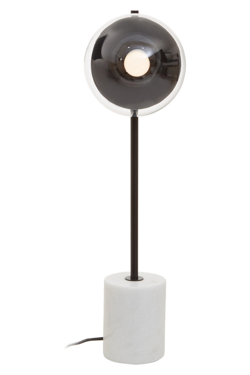 Modern table lamp with black shade and white base on a white background