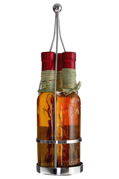 Bottle of olive oil and vinegar with a metal holder on a white background
