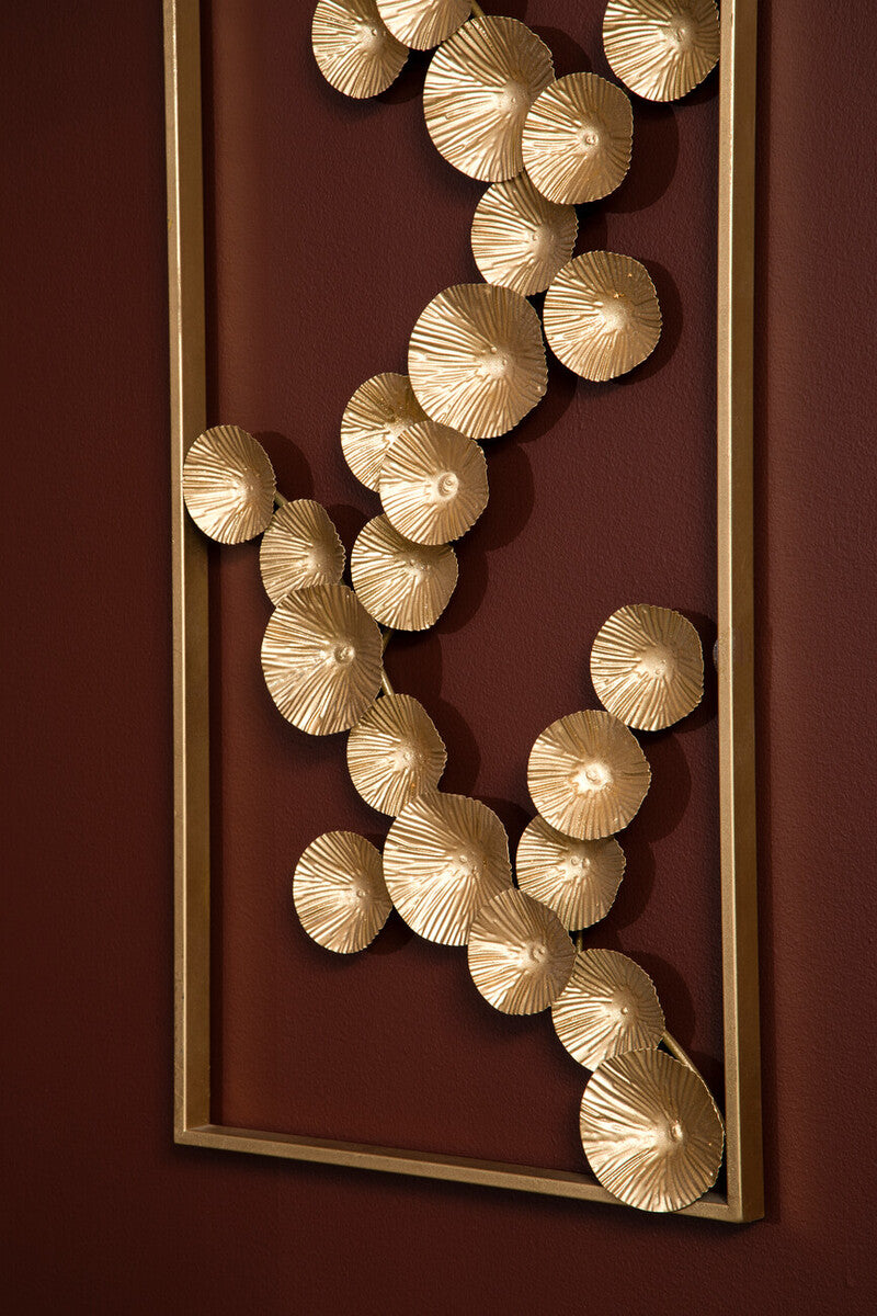 Decorative wall art with gold circular elements on a red background