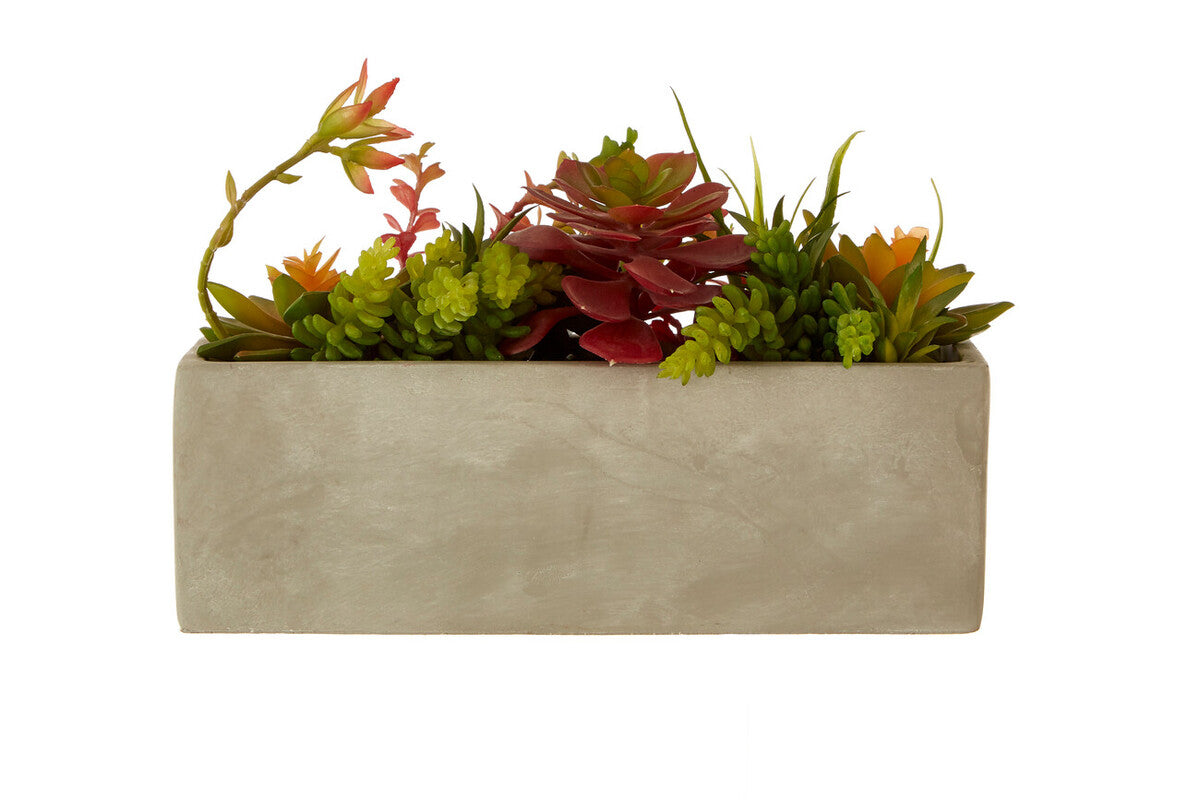 Rectangular concrete planter with artificial succulents on a white background