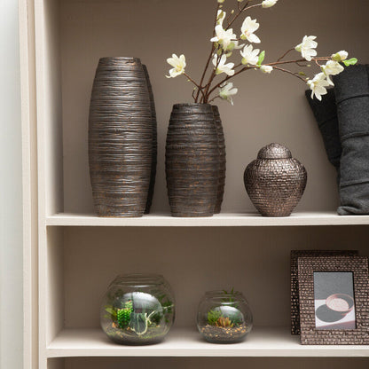 Decorative items including vases, a framed picture, and candles on a shelf.